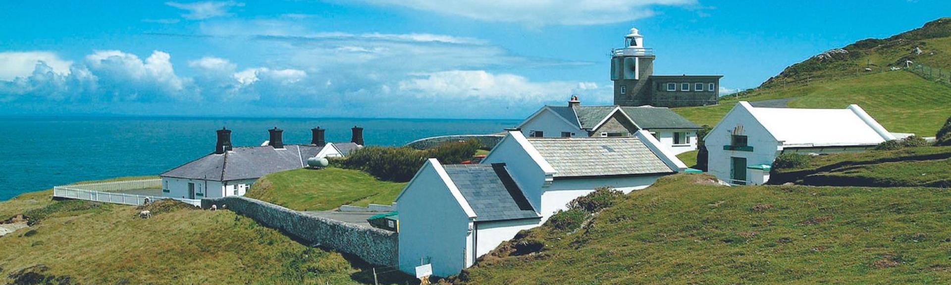A lighthouse holiday cottage complex on a rugged North Devon clifftop.