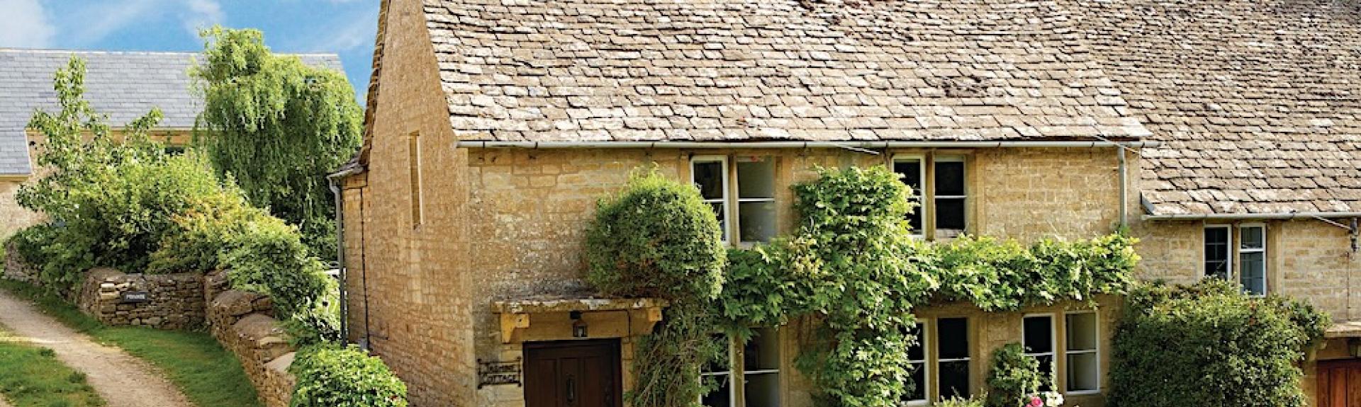 A jasmine-clad, semi-detached, traditional Cotswold 'honeystone' country cottage. 