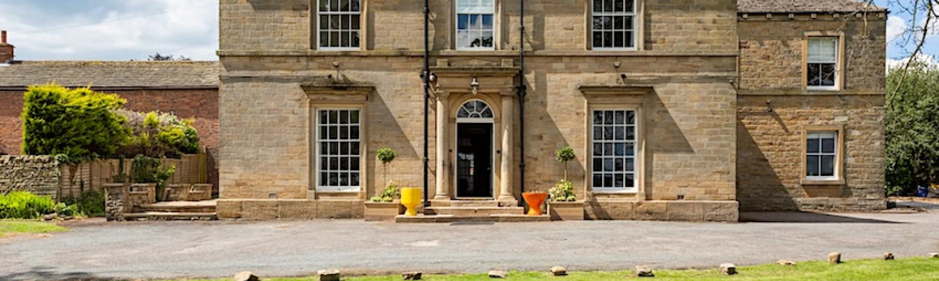 2-storey, stone-built, Georgian country house overlooking spacious lawns.