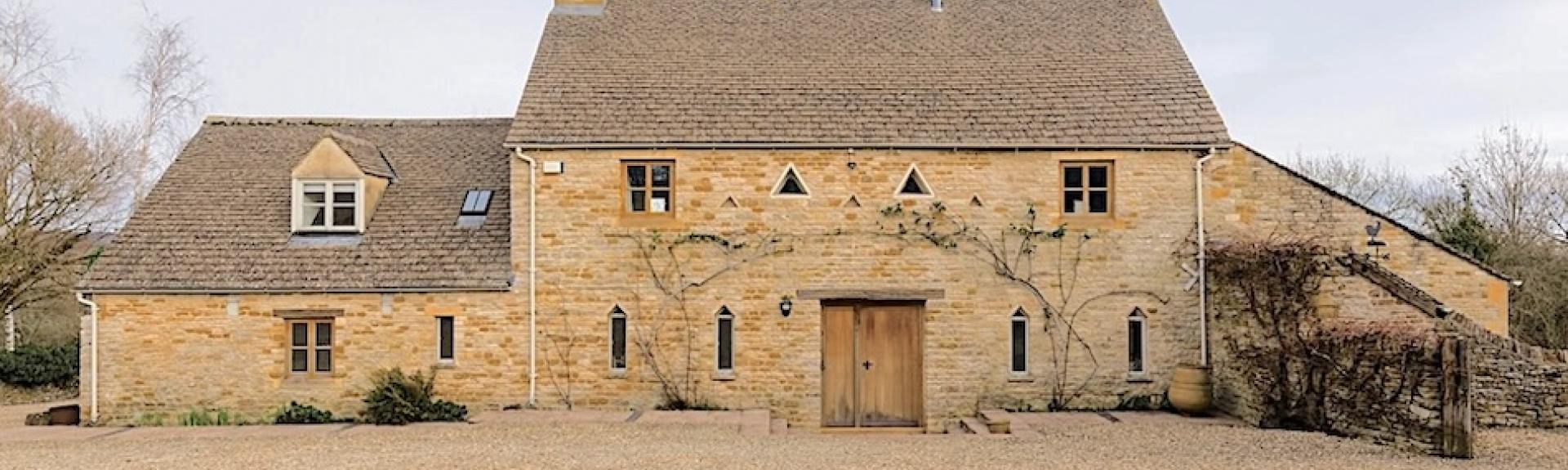 A large Cotswold barn conversion to form a holiday cottage in open countryside.
