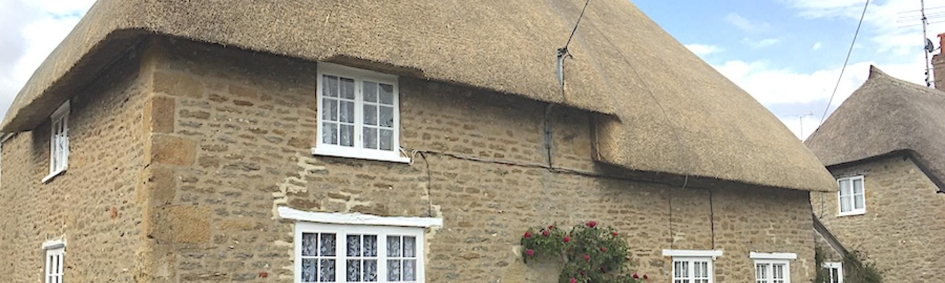 A 2-storey, thatched Dorset holiday cottage on a quiet village street.