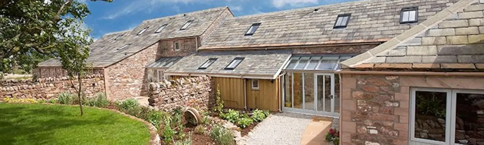 A rambling, stone-built cottage in Cumbria with a terraced garden