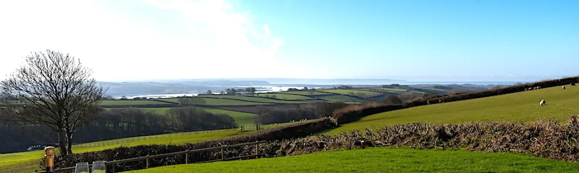 A hot tub with views across open countryside.