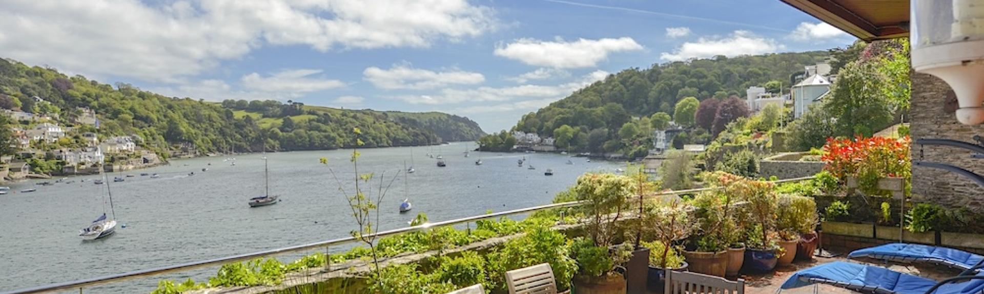 A view of Dartmouth estuary seen from the covered terrace of a waterside holiday let
