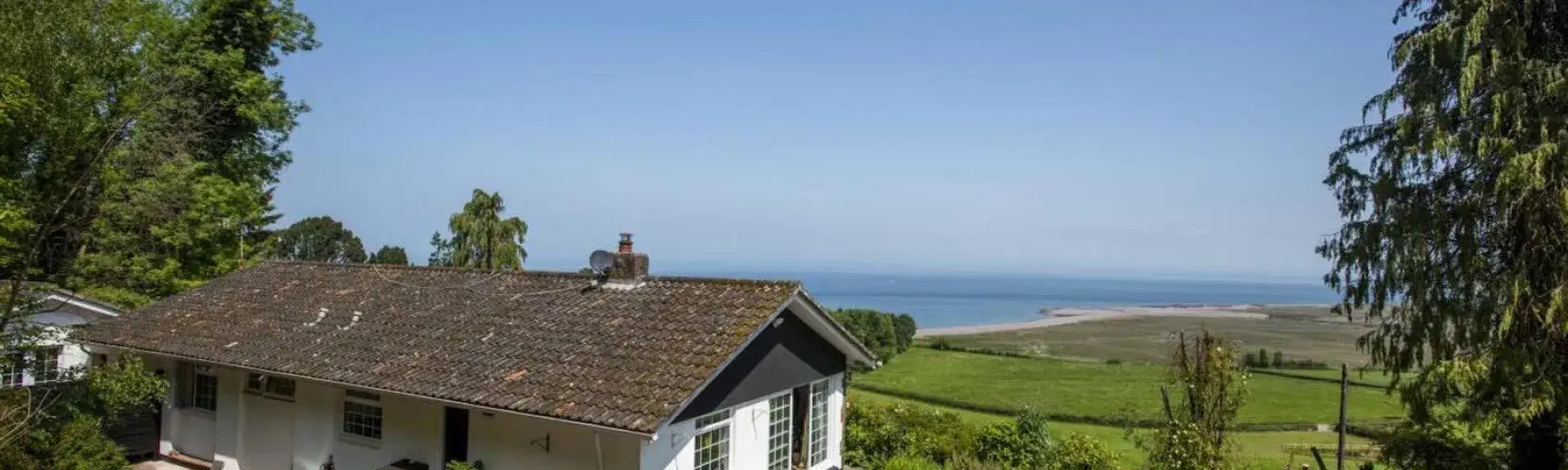 A modern bungalow in an elevated remote rural location wit sea views. 