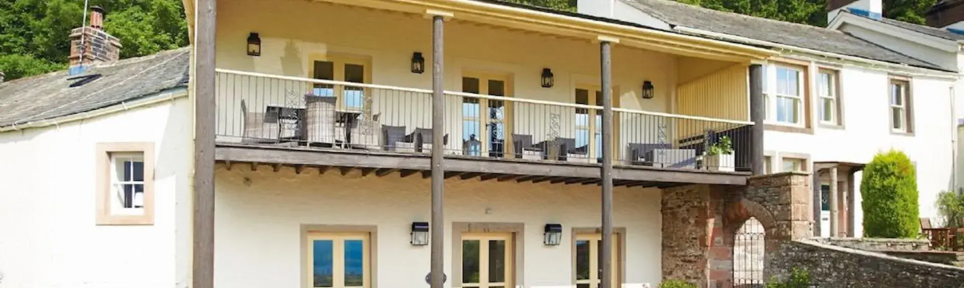 Ulleswater holiday cottage with a full length balcony and front terrace.