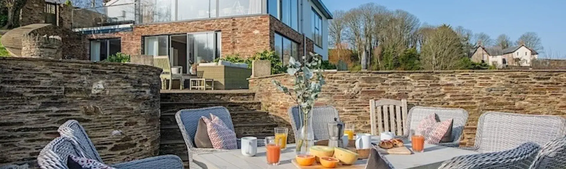 Luxury holiday home with 1st floor being all windows with a roof terrace above.
