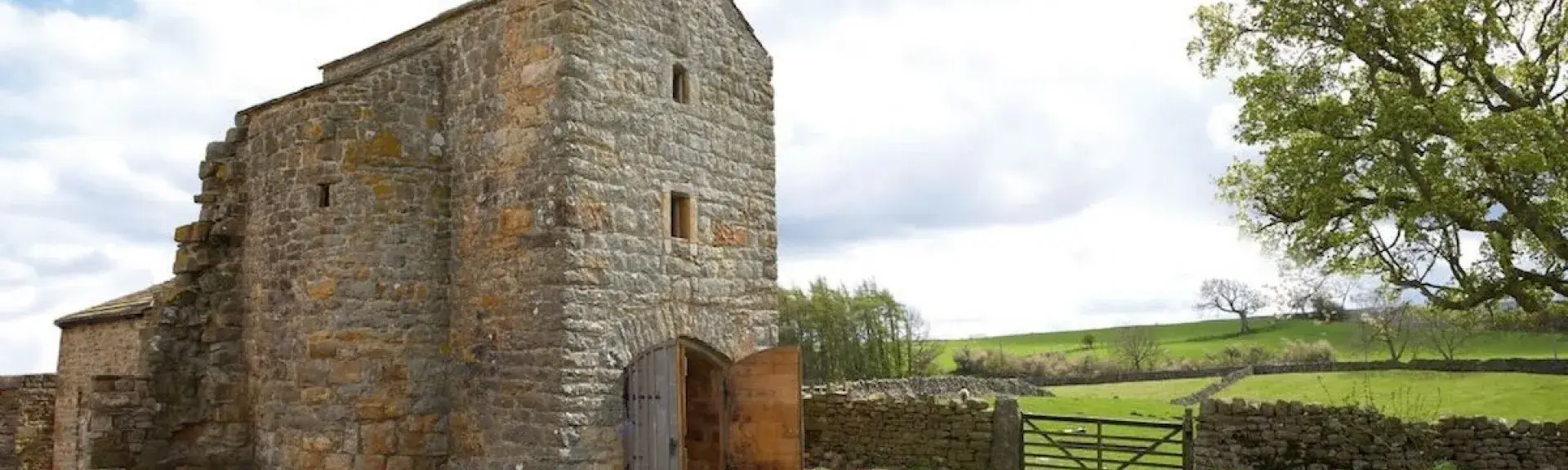 Exterior of a sympathetically restored 3-storey farmhouse in County Durham.