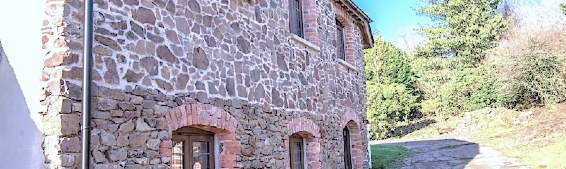 2-storey, stone-built holiday lodge in a rural location.