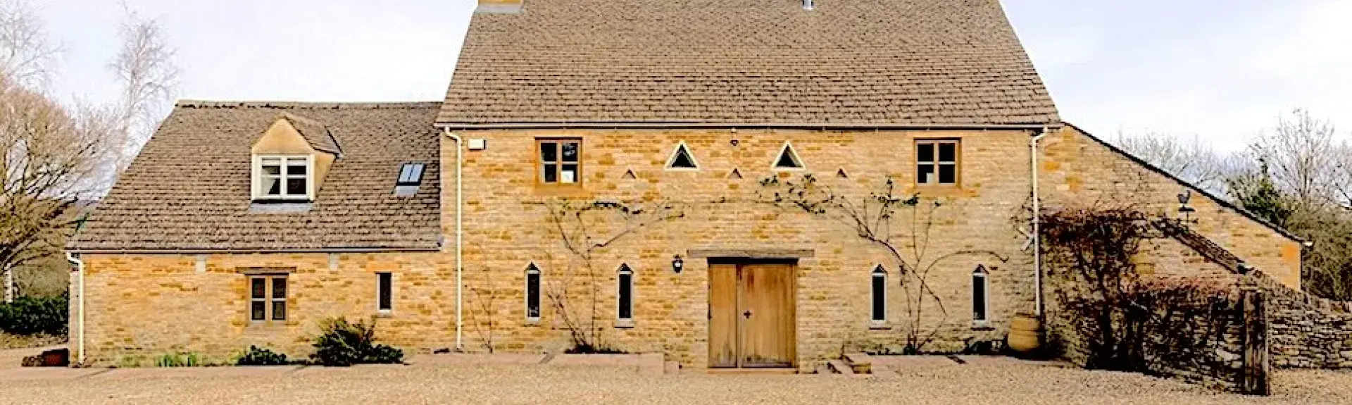 A large Cotswold barn conversion to form a holiday cottage in open countryside.