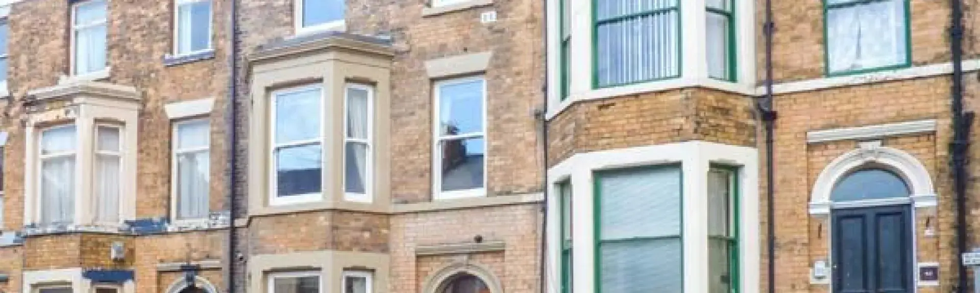 Terraced, 4-storey, Victorian Seaside Townhouse with bay windows.