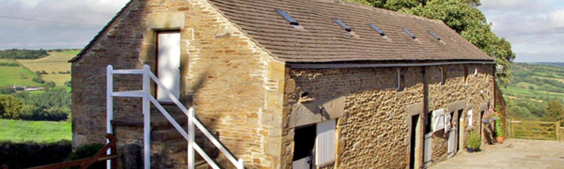 A 2-storey barn conversion with a courtyard and far-reaching rural views