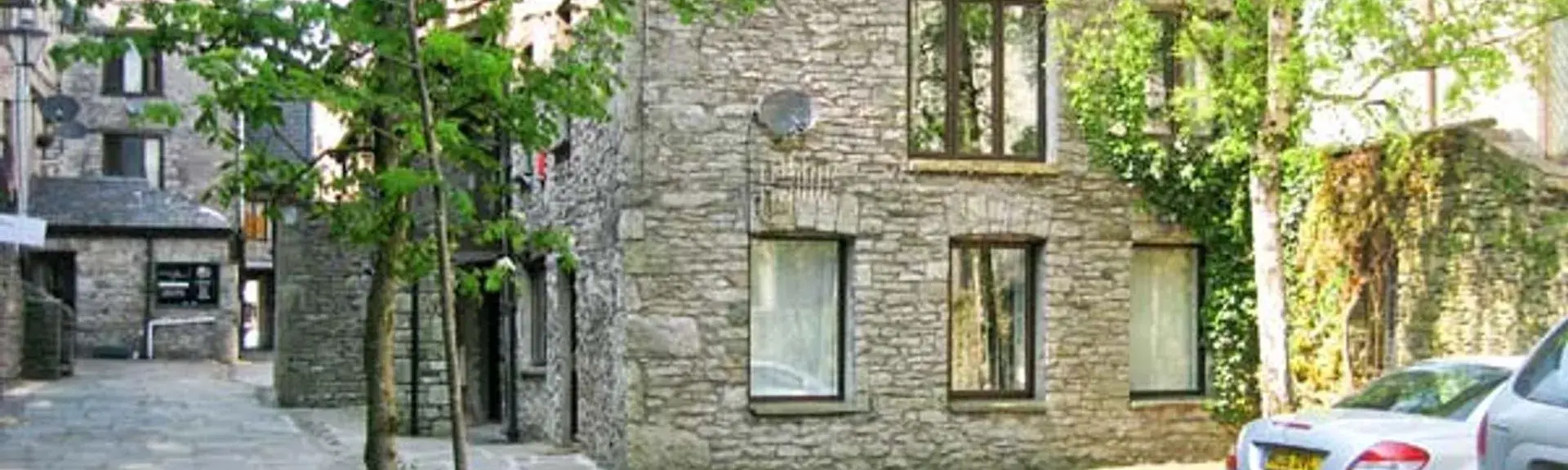 A 3-storey, stone-built holiday apartment in KEndal in a tree-lined courtyard.