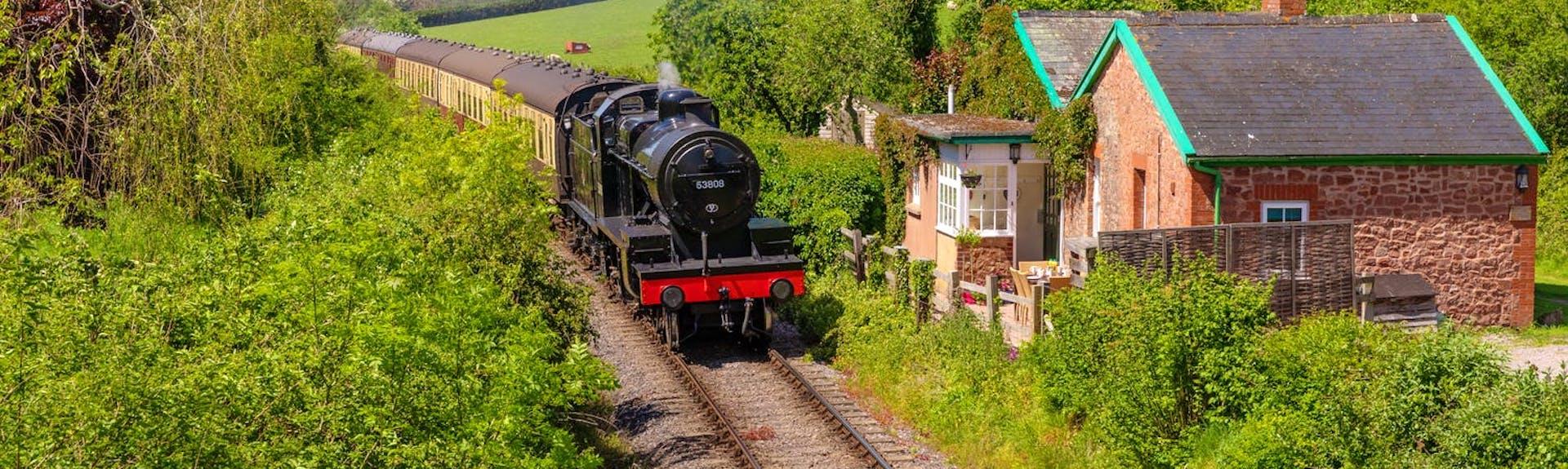 A steam engine glides by a Somerset holiday cottage on a summer's day/