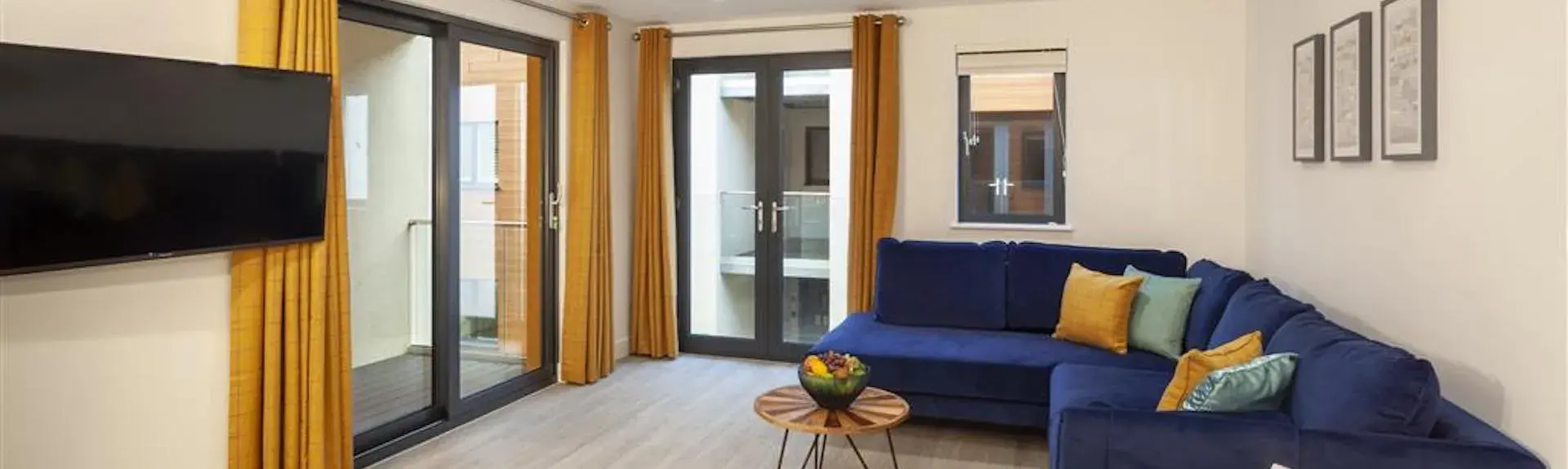 Spacious, open-Plan interior of a modern seaside holiday apartment.