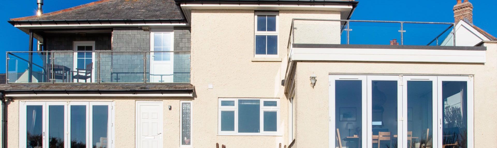 Large cottage with balcony and floor-to-ceiling French windows in Padstow.