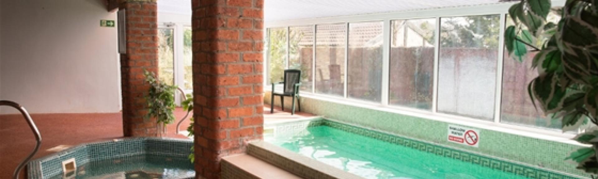 An indoor heated swimming pool at a Pickering holiday cottage