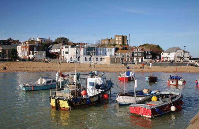 View Broadstairs Holiday Homes Available to Book Fishing boats in Broadstairs moored off a shingle beach behind which stand a huddle of old fishermen's cottages