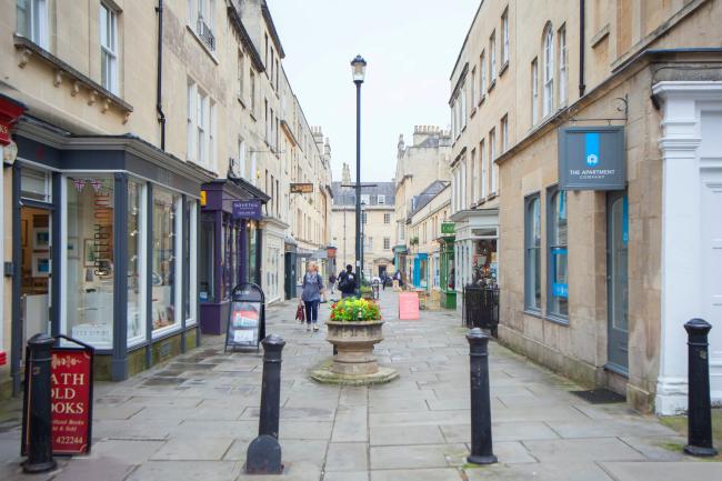 Credit: The Georgian Courtyard, a City Centre Cottage for Couples A pedestrian street in Bath showing Georgian buildings and shop frontss