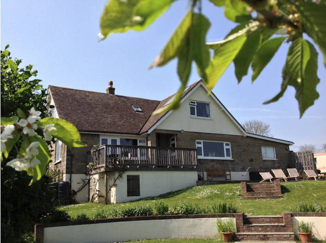 Three Gables Holiday Cottage in Newbridge A modern Isle of Wight holiday home with a large gable end surrounded by lawns