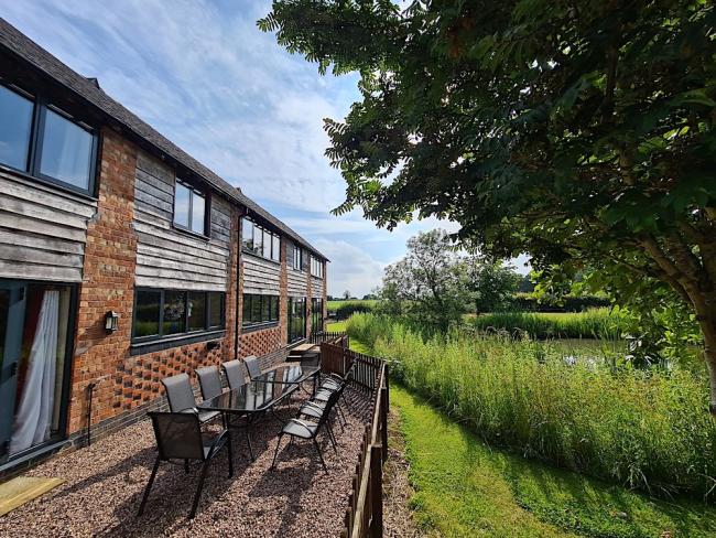 Exterior of a riverside Whitchurch barn conversion.