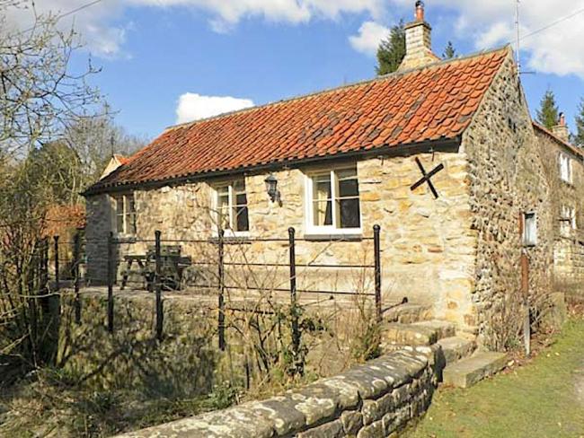 Beckside, A 1-Bedroom Holiday Cottage For Couples in Lastingham Exterior of a stone-built, single-storey stable converted to a holiday cottage.
