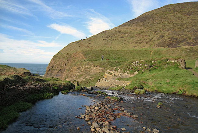 Seaside Cottage Holidays in Welcombe A small river in a valley flows through walks towards the distant sea