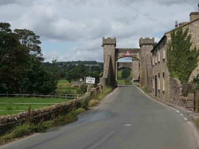 View Leyburn Holiday Cottages Available to Rent The road entering Leyburn runs under a stone-built arch.
