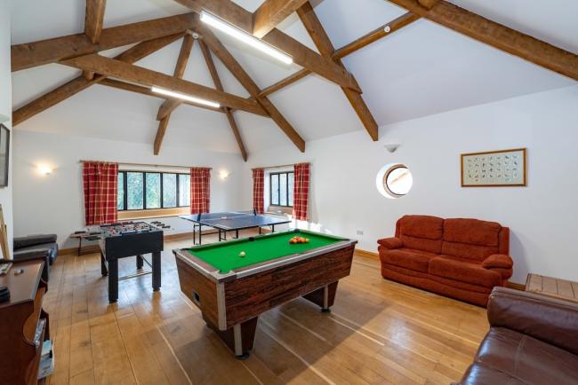 Holiday Cottages With A Games Room with Pool A holiday cottage games room with table football, table tennis an pool tables. in a games room.