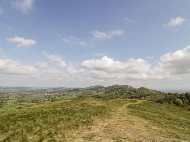 Malvern Hills Holiday Cottages. Photo credit: Beesoni Lodge A footpath meanders across the rocky crest of The Malvern Hills.