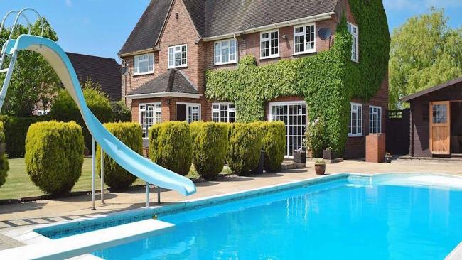 View Our Portfolio of UK Holiday Cottages with Private or Communal Pools. A Warwickshire holiday cottage with an outdoor pool and waterslide.