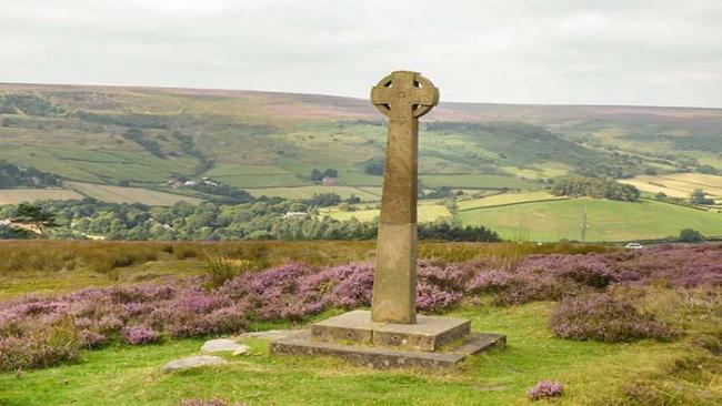 View North Yorkshire Coast and Country Holiday Homes. A stone Celtic cross at a high point overlooking the North York Moors.