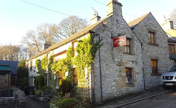 Derby Cottage, a stone-built, ivy-clad Peak District holiday cottage.