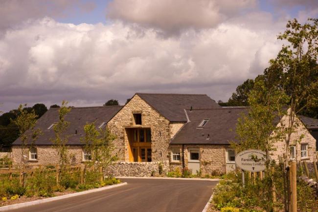 Peak District, stone-built farmhouse and garden.