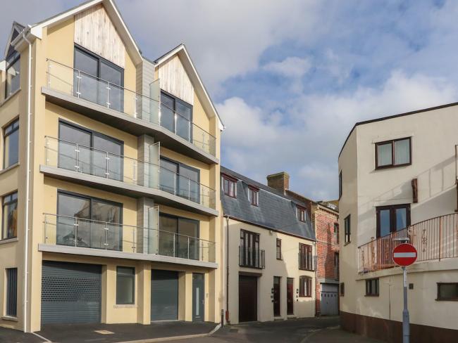 4-storey exterior of contemporary harbourside apartments in Weymouth.