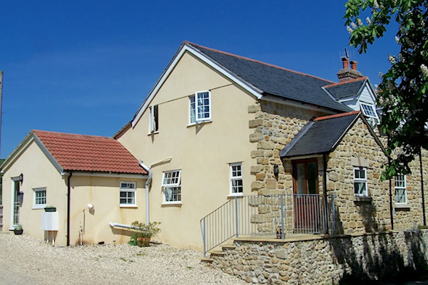 2-storey exterior of a stone-built, large Dorset holiday cottage