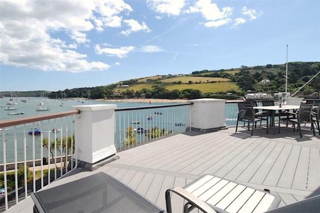 An estuary view from a deck of a waterside holiday apartment in Salcombe.