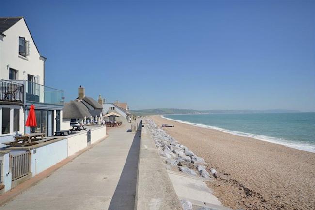 A holiday apartment overlooks a long sandy beach in South Devon.