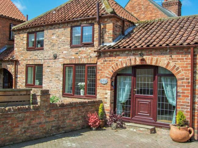 Two-storey brick exterior of a holiday home in Beverley