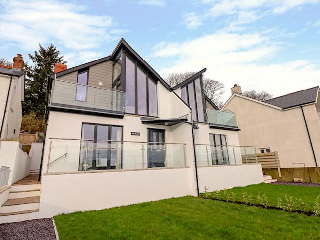 2 storey contemporary house with floor to ceiling windows, terrace nd garden