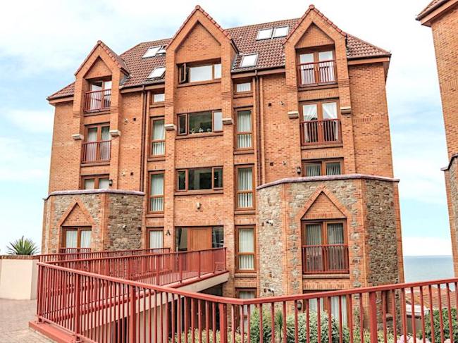 Exterior of a 5-storey brick built block of seaside holiday apartments in North Devon.