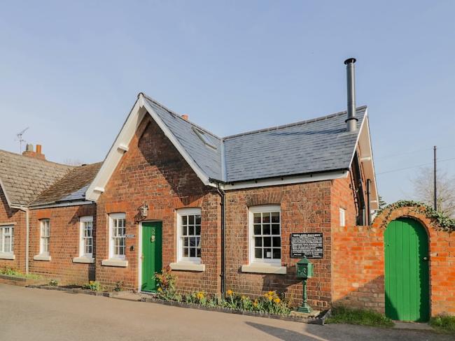 Single storey exterior of a restored Station Masters cottage.