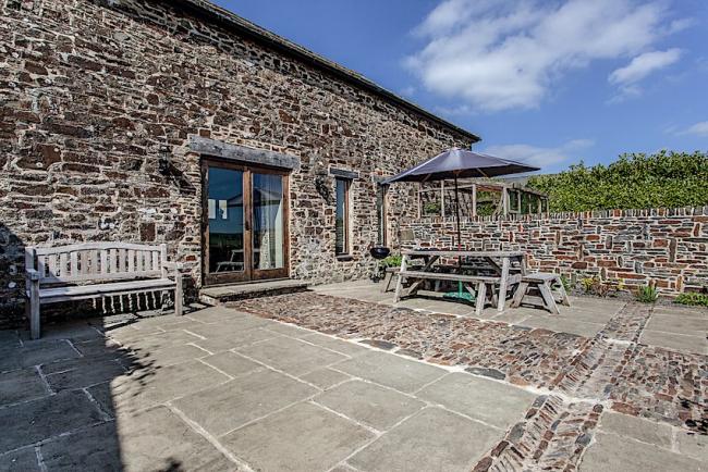 Exterior and courtyard of a stone-built, Exmoor barn conversion