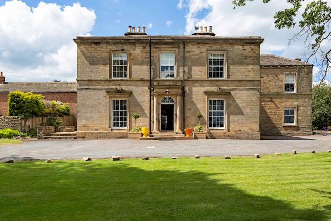2-storey, stone-built, Georgian country house overlooking spacious lawns.