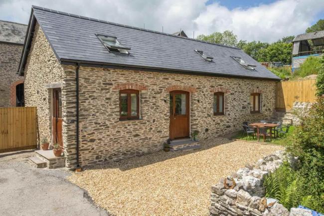 An Exmoor stone barn conversion within a courtyard in the North Devon countryside