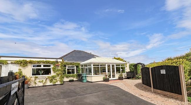 Seaside Bungalow wit conservatory and large parking area.