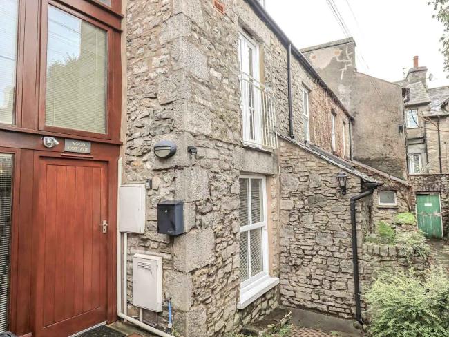 1st floor exterior of a stone-built Kendal holiday cottage.