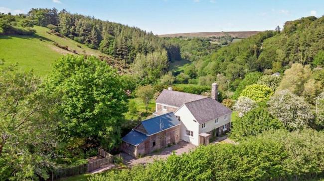 A large Exmoor holiday cottage nestles in a remote wooded valley.