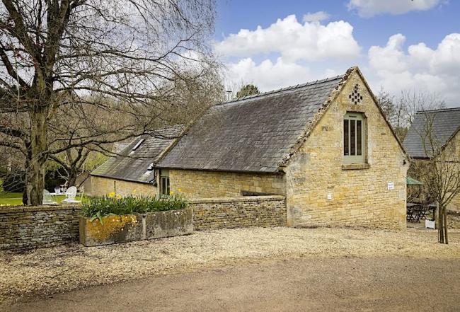 A Luxury Cotswold Farm Barn Conversion within a walled garden.