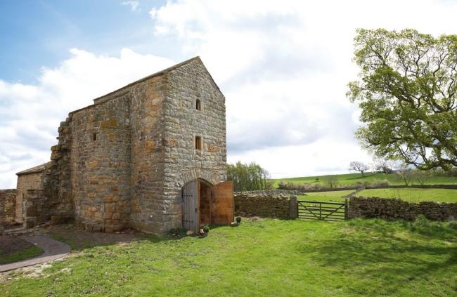 Exterior of a sympathetically restored 3-storey farmhouse in County Durham.